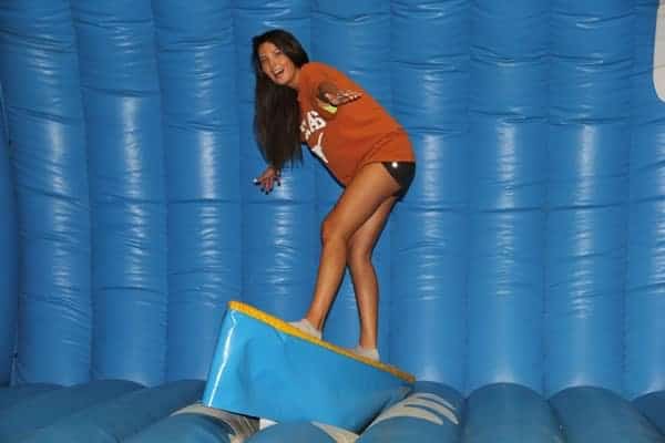 Texas girl on surfboard simulator - Party rental